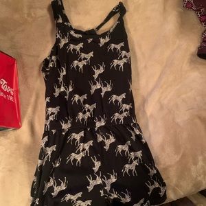 Kids black romper with white zebras on it